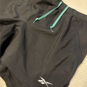 Reebok Men's Black Athletic Shorts with Teal Accents